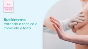 Entenda a técnica do sutiã interno em implantes de silicone Imagem de uma mulher tocando uma prótese de silicone