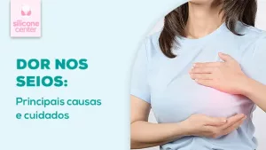 Imagem mostrando uma mulher com as mãos nos seios sinalizando dor no local